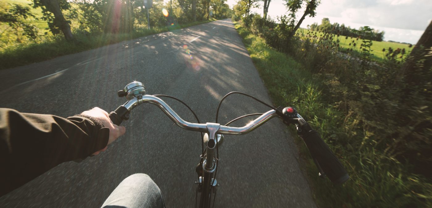 Bike riding in an open road in the country side