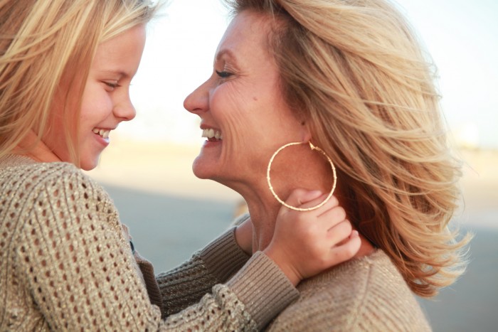 Happy retired woman with her granddaughter