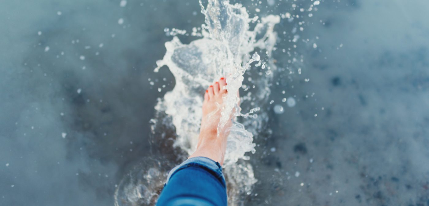 Water splashing with a woman's feet