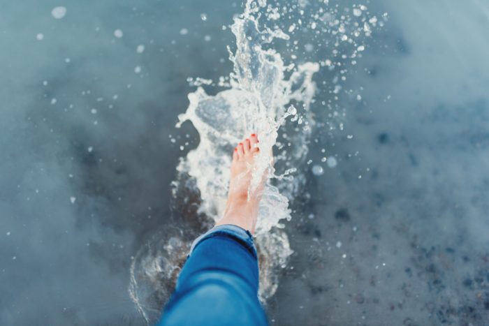 Water splashing with a woman's feet