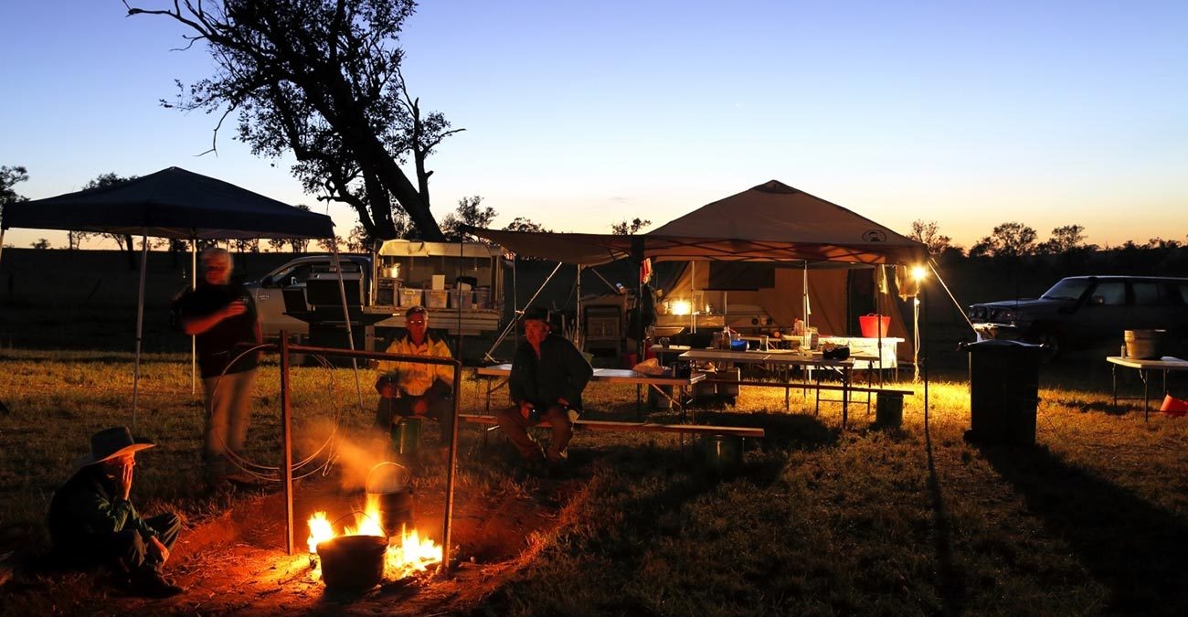 Campers gathered around a campfire