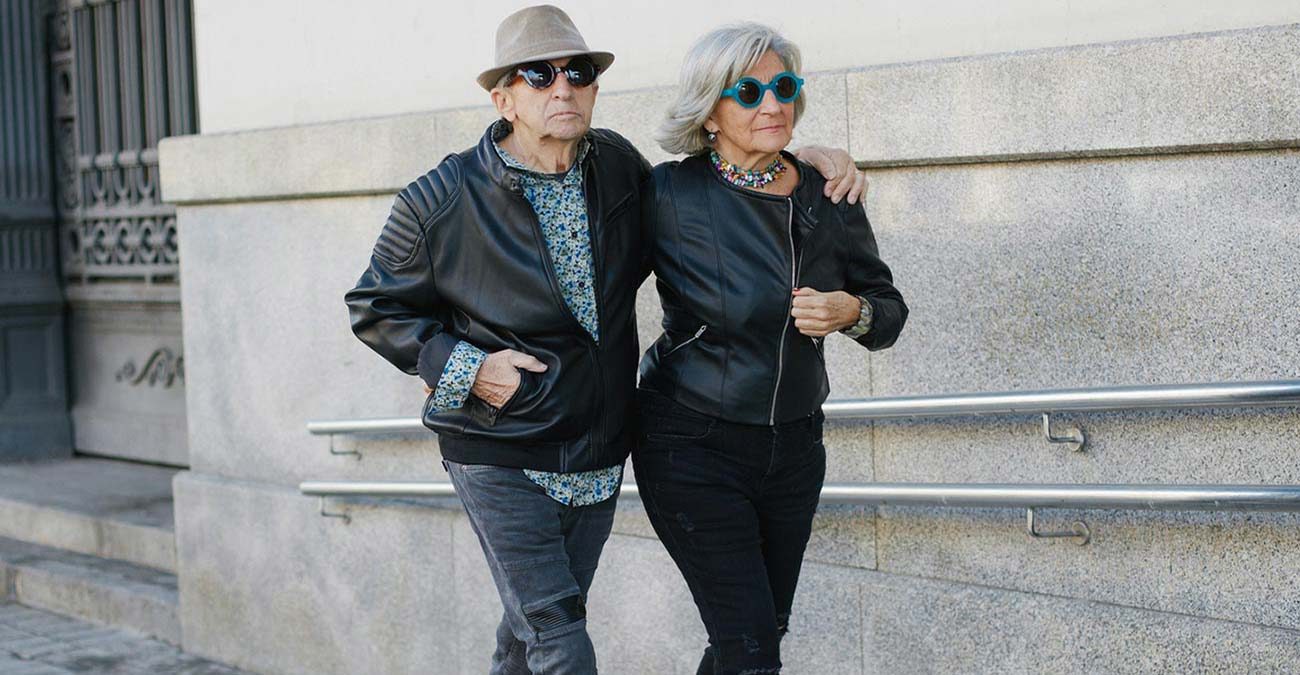 Fashionable senior couple walking together