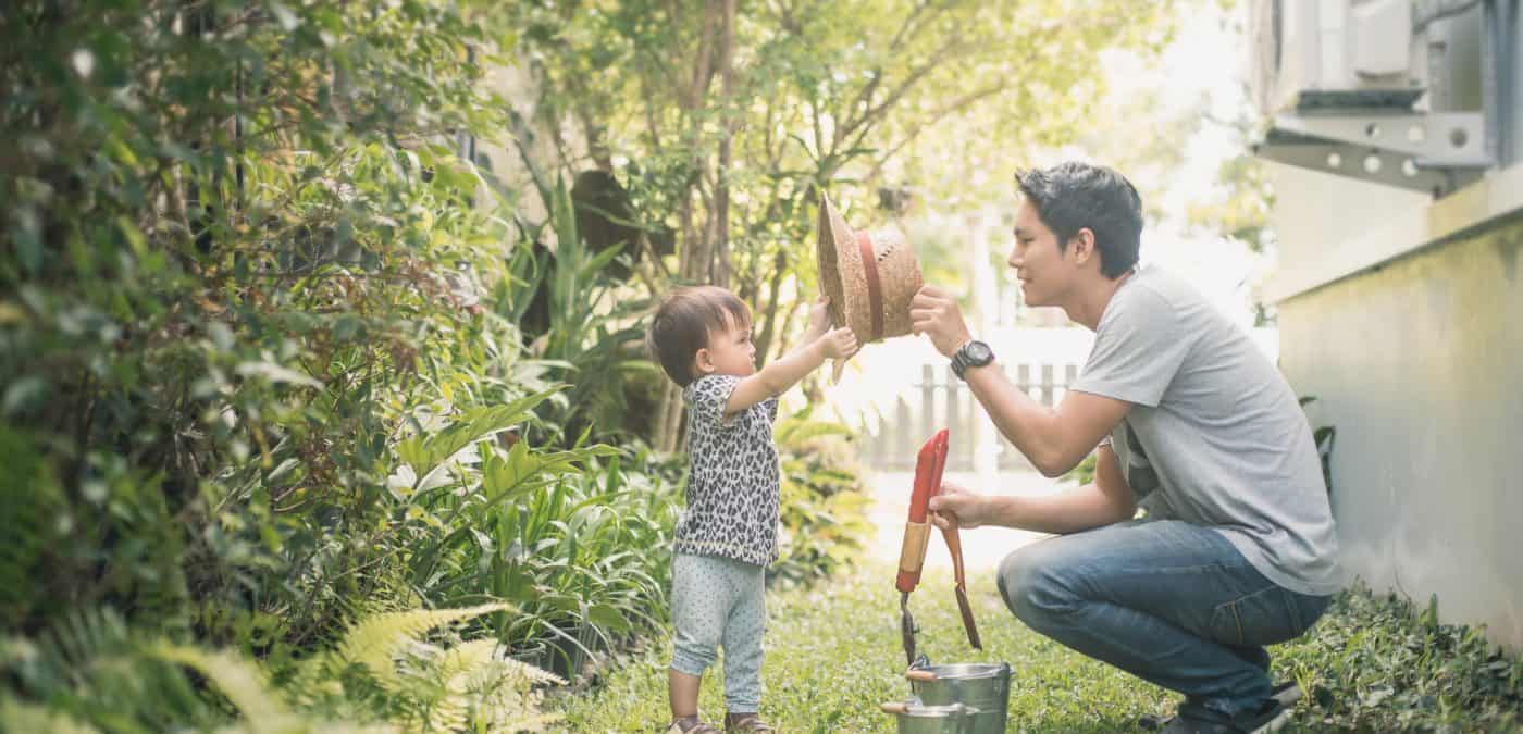 Happy joyful young father with his little daughter.