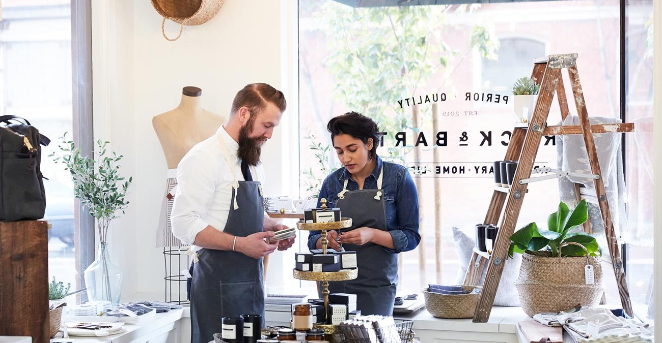 Millennial co-workers talking and working together