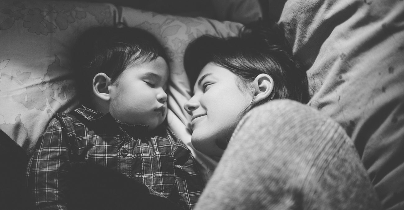 Mom and toddler baby napping