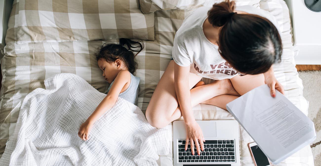 A mother with her daughter lodging her tax online