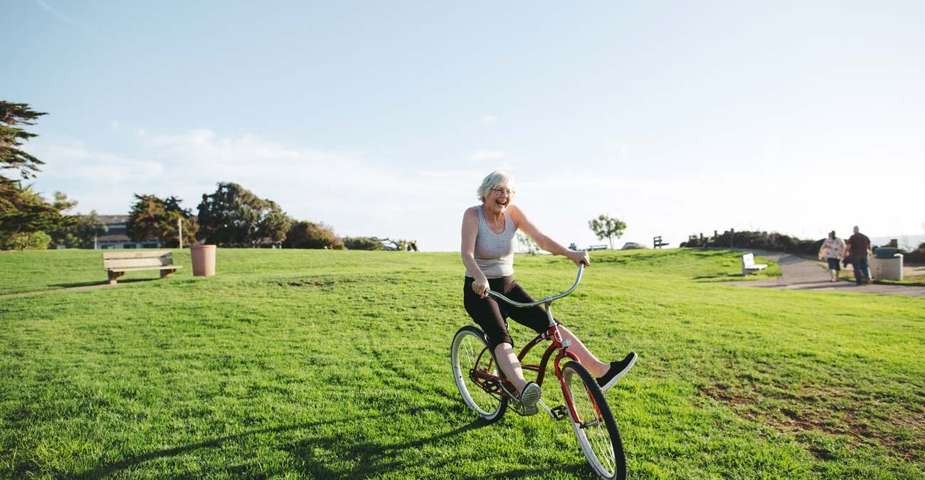 Elderly woman on bike