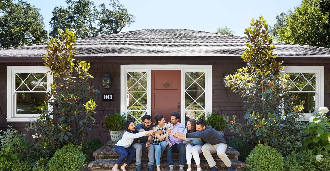 Group of friends celebrating a couple's first home purchase