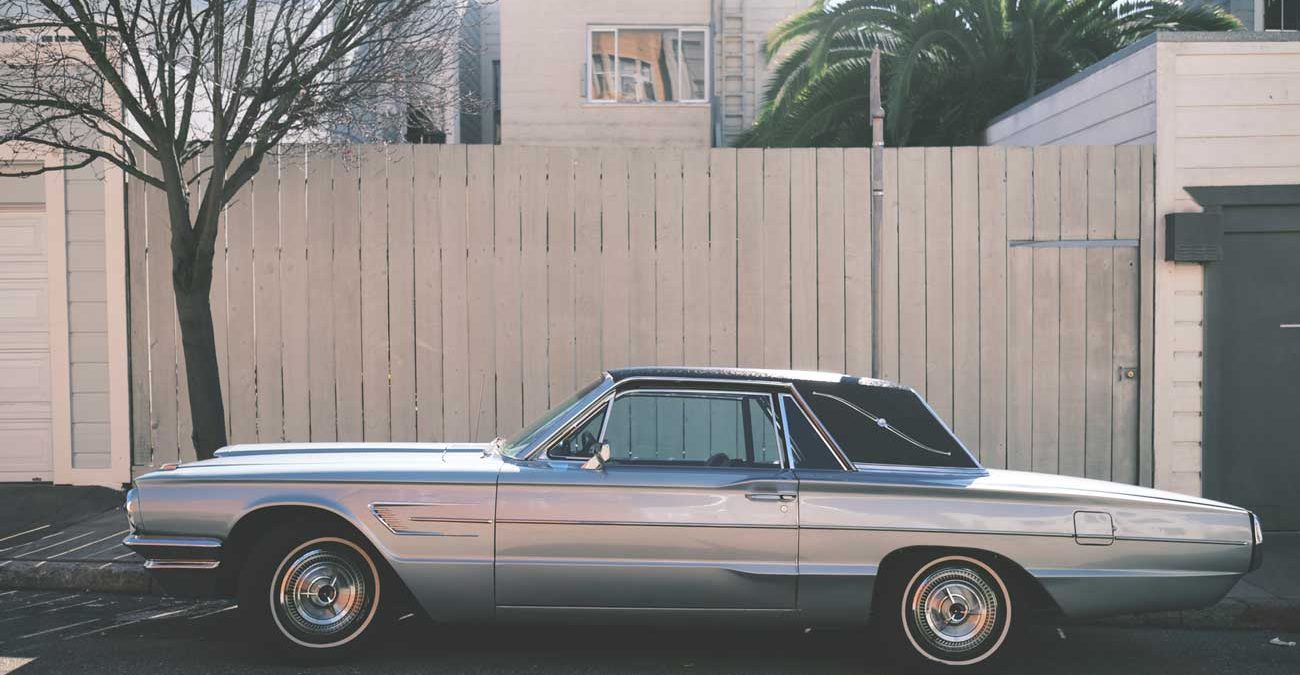 grey vintage car on the street