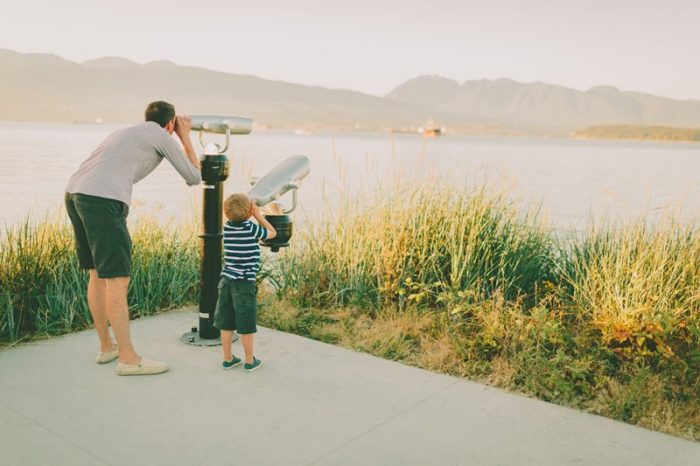 father and son overlooking the lake