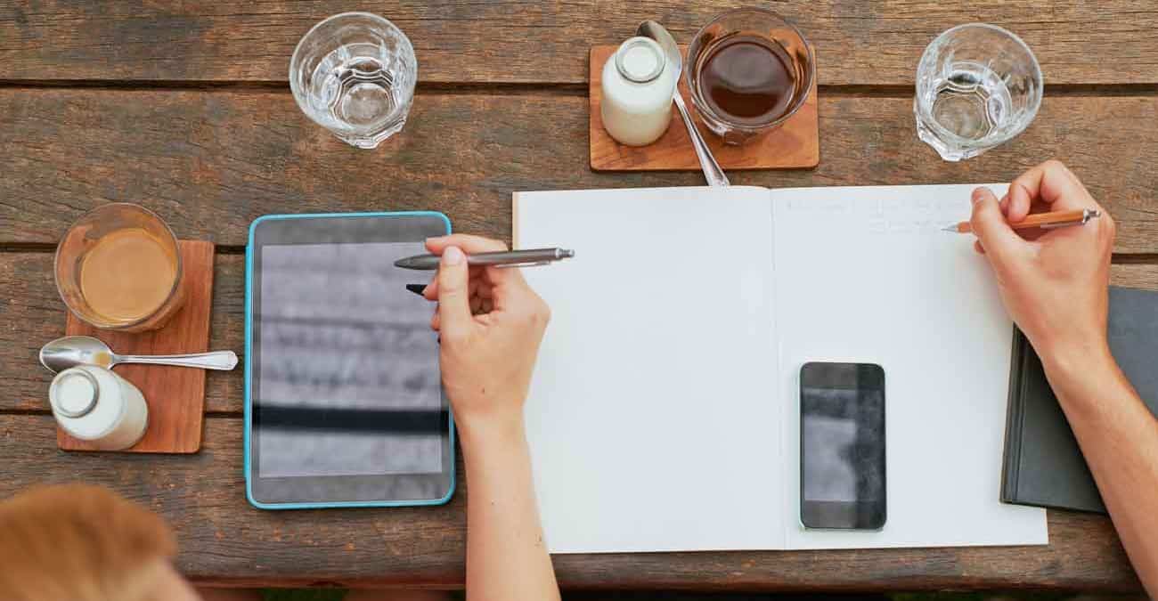 Young entrepreneurs having a creative business meeting in a cafe