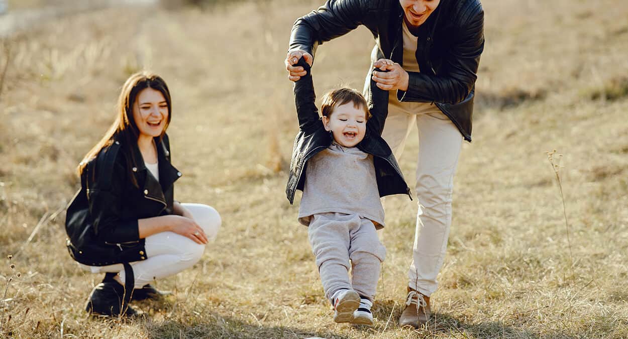 young family playing ball