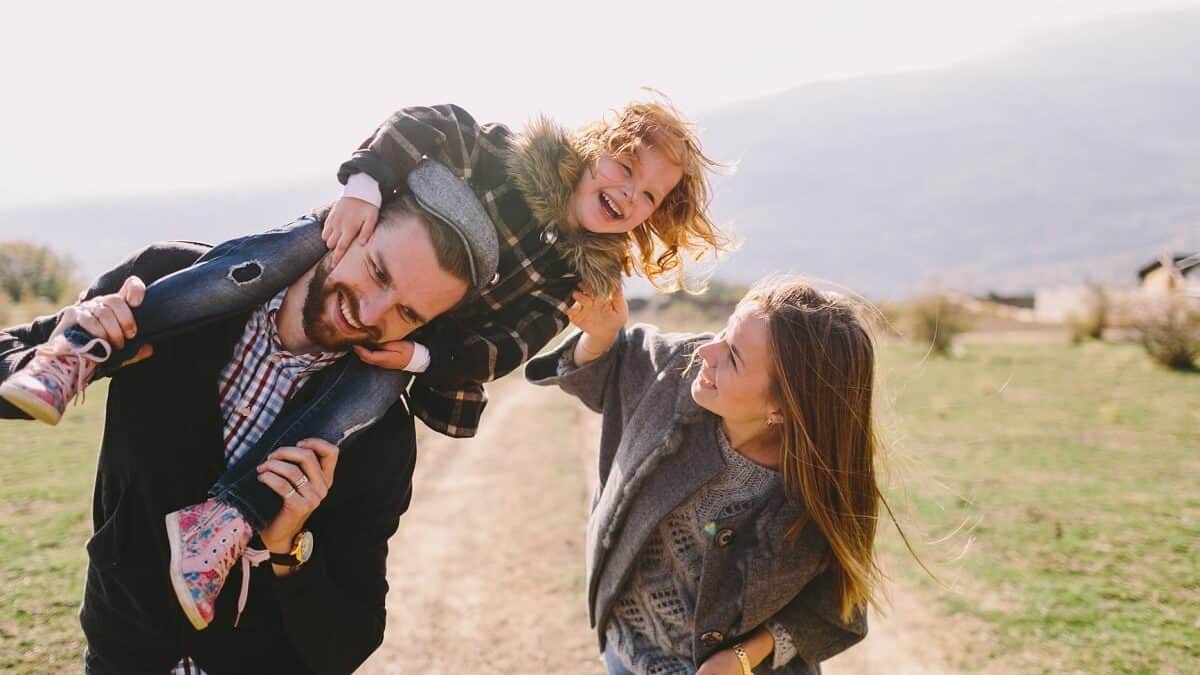 young family laying outdoor